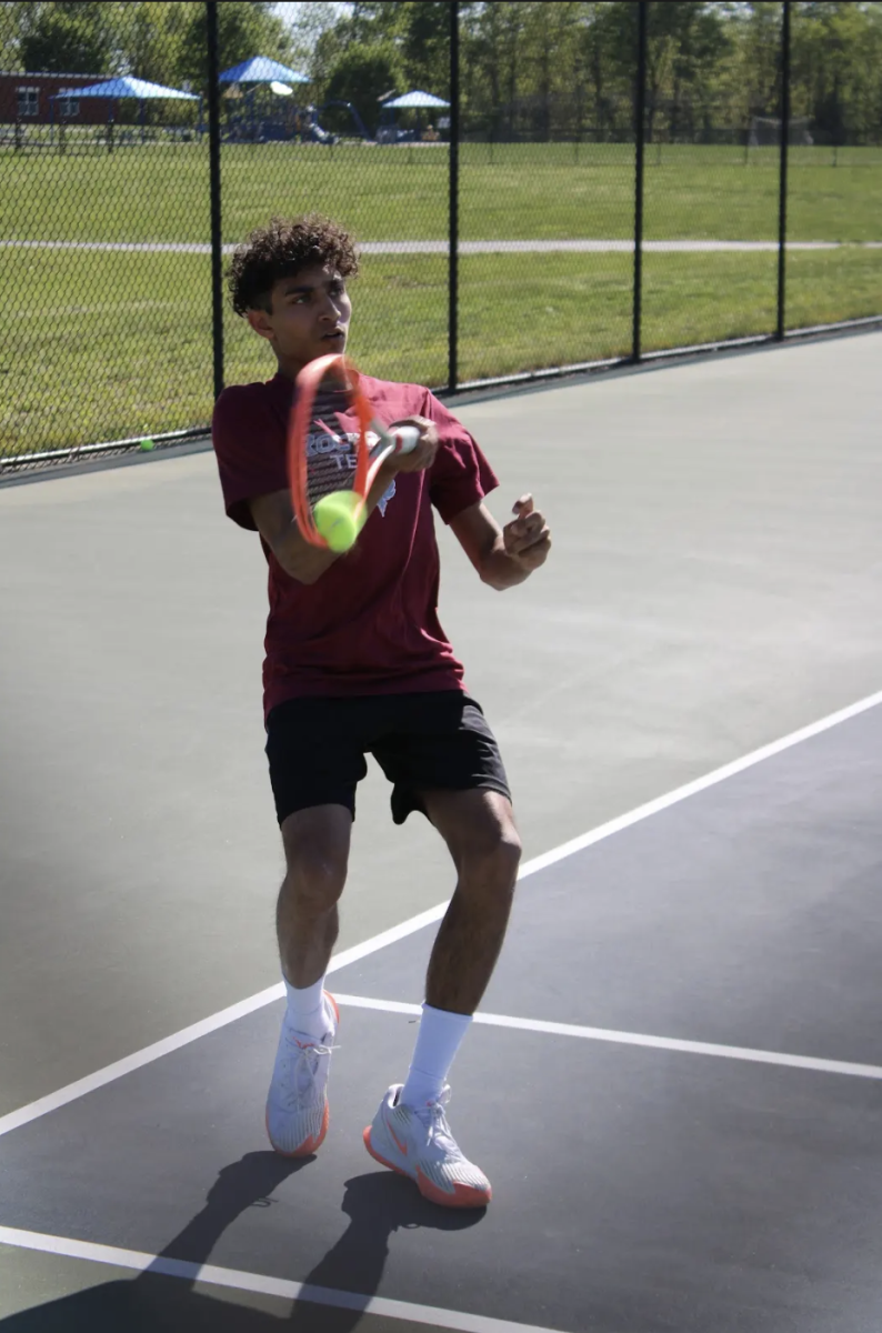 With his eyes on the prize, the Phoenix varsity all-time number two player, Akash Vangale returns the ball against the Tuscarora Huskies.
